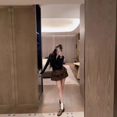 Black Long Sleeve Top Brown Tiered Skirt Casual Outfit